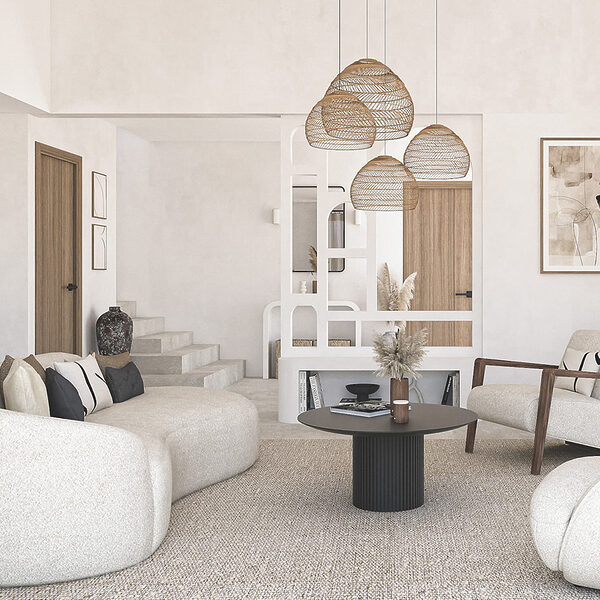 Salon d’une villa à Antibes décoré dans un style méditerranéen minimaliste, avec meuble d’entrée sur mesure en siporex à double fonction, réalisé par Jennifer Fauchart, designer d’intérieur – Agence ELEGANCE
