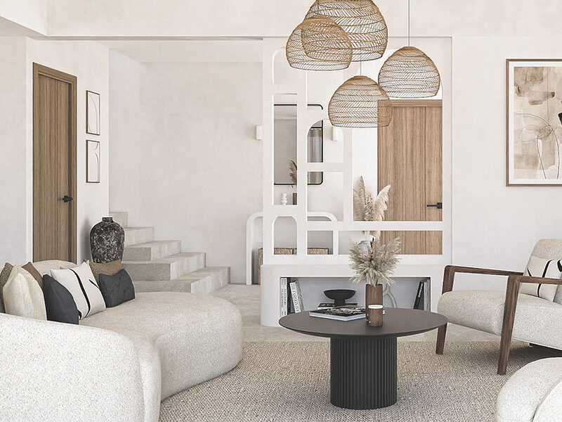 Salon d’une villa à Antibes décoré dans un style méditerranéen minimaliste, avec meuble d’entrée sur mesure en siporex à double fonction, réalisé par Jennifer Fauchart, designer d’intérieur – Agence ELEGANCE